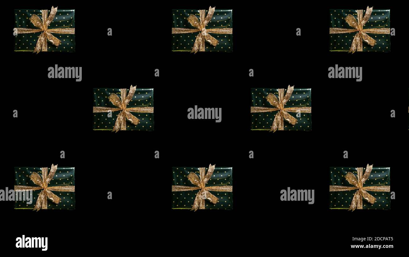 christmas pattern green gift boxes on black background Stock Photo