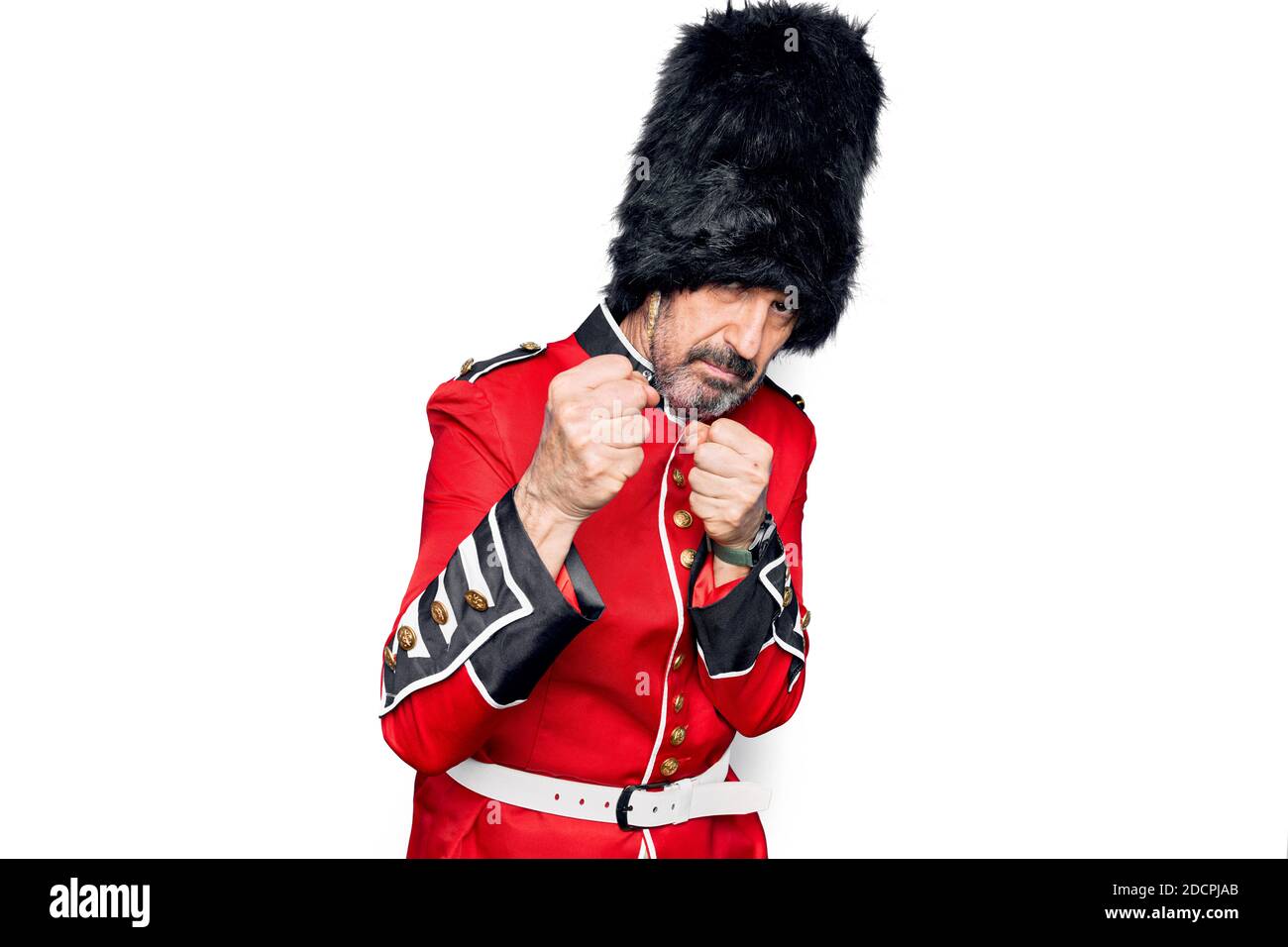Middle age handsome wales guard man wearing traditional uniform over ...