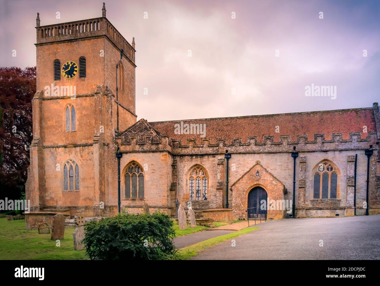 The St Michael & All Angels' parish Church, a Grade II* listed building, is the site of TS Eliot's interred ashes in East Coker, Somerset, England Stock Photo