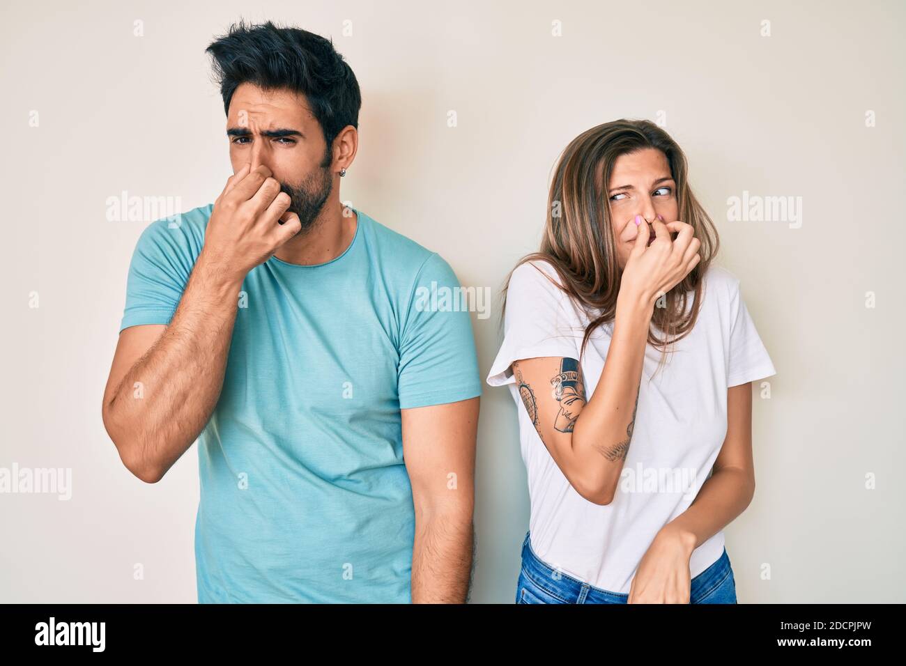 Beautiful young couple of boyfriend and girlfriend together smelling