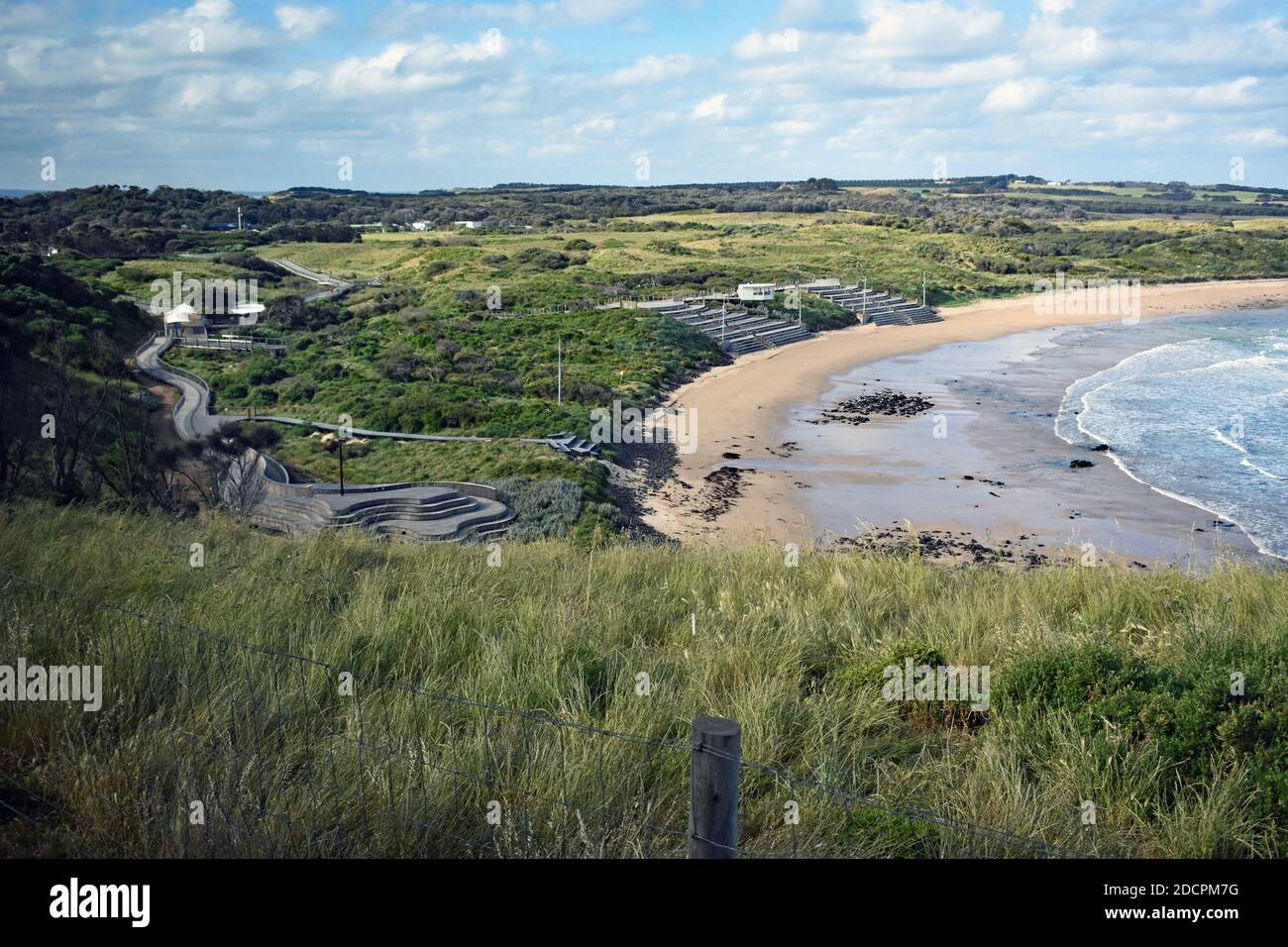 View over Summerland Bay on Phillip Island, Victoria, Australia.   The penguin parade seating area and boardwalks can be seen on the beach below. Stock Photo