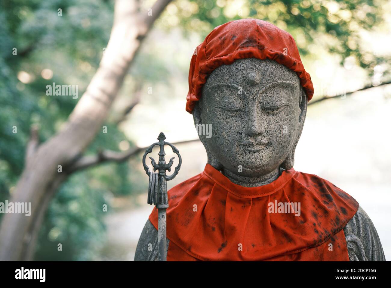 Stone statue at a Buddhist temple in Tokyo, Japan Stock Photo