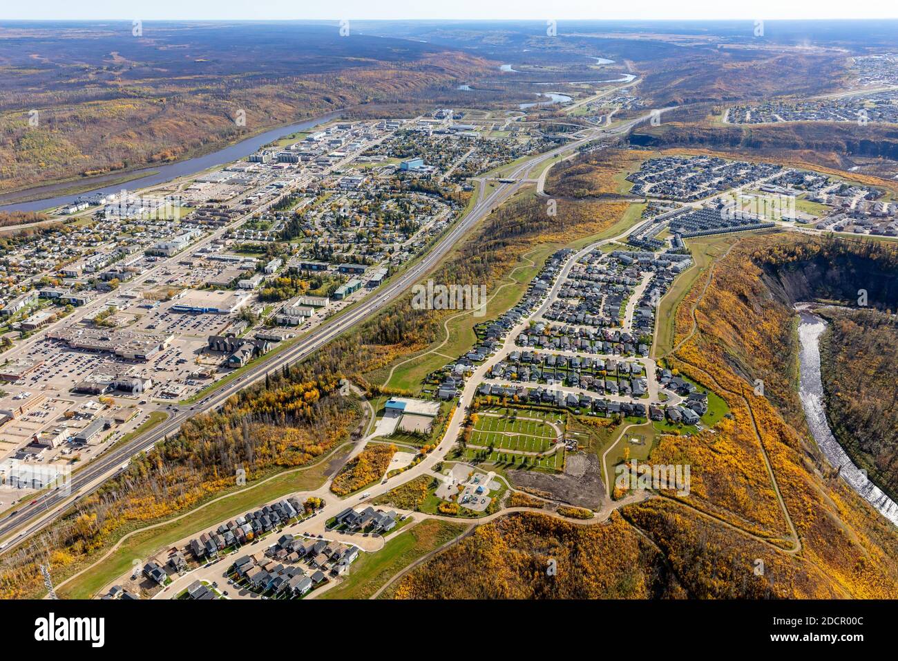 Aerial photo of downtown and lower townsite in Fort McMurray, Alberta Canada including hilltop residential developments. Stock Photo