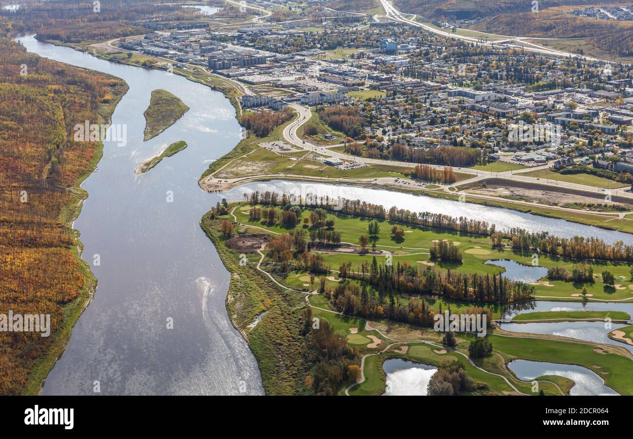 Aerial photo of the Clearwater River and Fort McMurray Alberta lower townsite with Miskanaw golf course in the foreground. Stock Photo