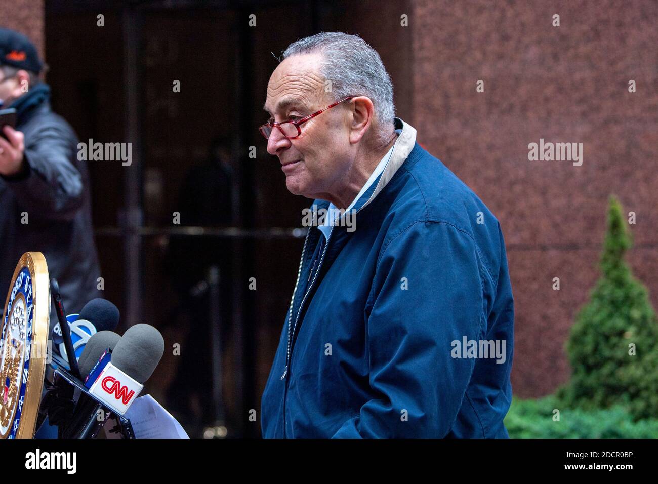 New York, United States. 22nd Nov, 2020. U.S. Senator Chuck Schumer speaks during a media briefing on COVID-19 and Navy Grumman Plume in New York City. Senator spoke of Navy to contain the Grumman Plume. Schumer asked President-elect transition team to oversee the U. S. Navy to clean up the plume. The Grumman Plume owned by U. S. Navy and Northrop Grumman was contaminated with toxic chemicals since mid 1970th at Bethpage facility sites in Long Island. Senator was holding Newsday newspaper which published an investigative report on The Grumman Plume. Credit: SOPA Images Limited/Alamy Live News Stock Photo