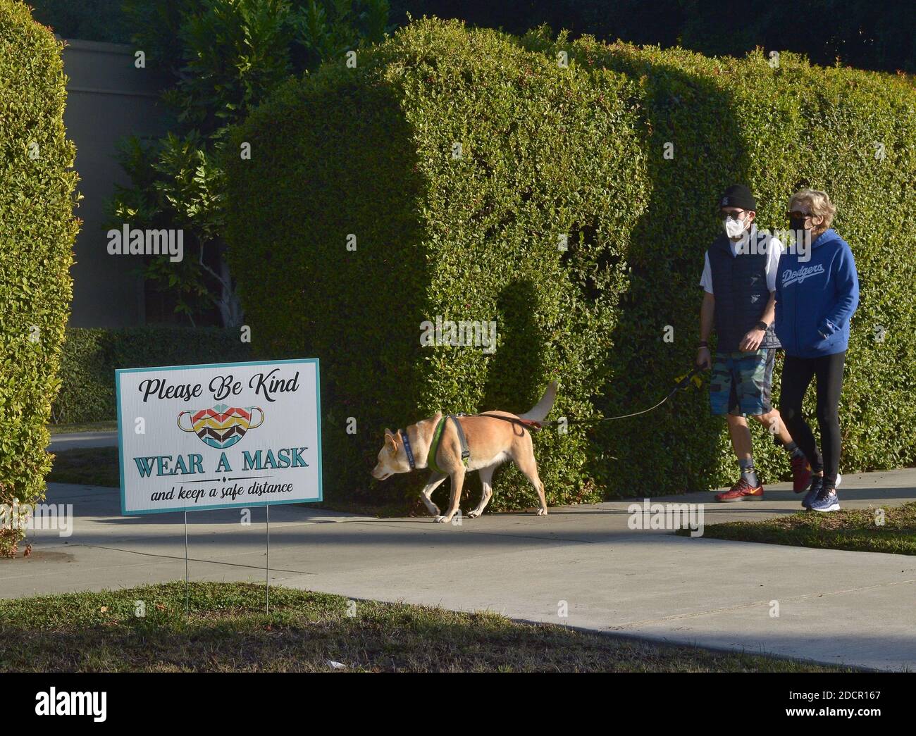 Los Angeles, United States. 22nd Nov, 2020. A sign near Mayor Garcetti's official residence urges residents to 'Wear A Mask' in Los Angeles on Sunday, November 22, 2020. Amid a surge in new COVID-19 cases in counties in the most restrictive purple tier of the state's coronavirus monitoring system, Garcetti and Gov. Gavin Newsom issued a 'limited Stay At Home Order' prohibiting all 'non-essential work, movement and gatherings' between 10 p.m. and 5 a.m. Photo by Jim Ruymen/UPI Credit: UPI/Alamy Live News Stock Photo