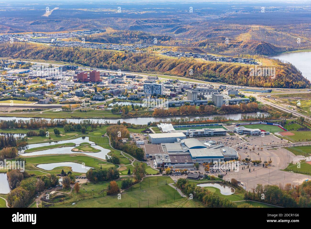 Aerial photo of MacDonald Island Park and Miskanaw golf course on MacDonald Island with Fort McMurray Alberta Canada in the background. Stock Photo