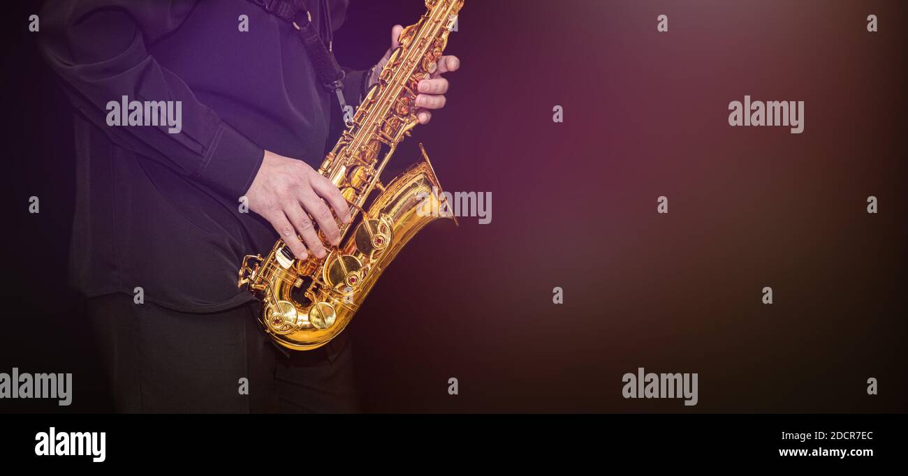 Saxophone Player hands Saxophonist playing jazz music. Alto sax musical
