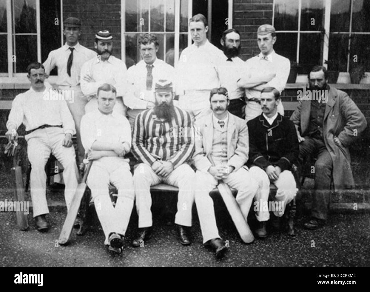Gloucestershire County Cricket Club in 1880 shortly before Fred Grace's untimely death. W. G. Grace is seated front left centre. Fred (hooped cap) is third left in rear group. Billy Midwinter (directly behind W. G.) is fourth left in rear. E. M. Grace (bearded) is sixth left in rear. Stock Photo
