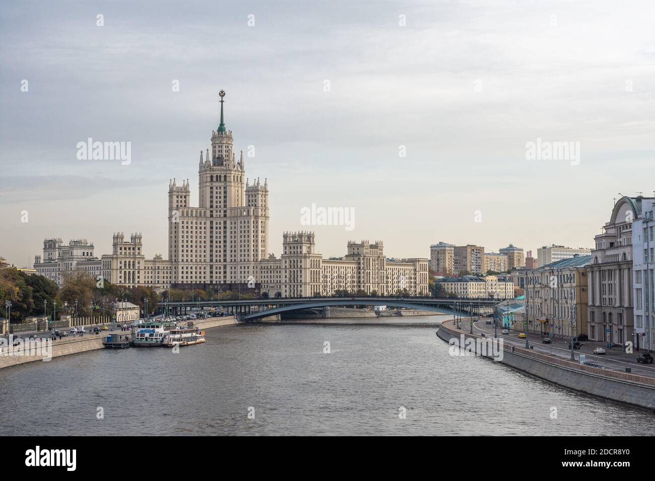 MOSCOW, RUSSIA - NOVEMBER 18, 2020: View from the new floating bridge of park Zaryadye on the frozen Moskva River Moscow River and Stalinist high-rise Stock Photo