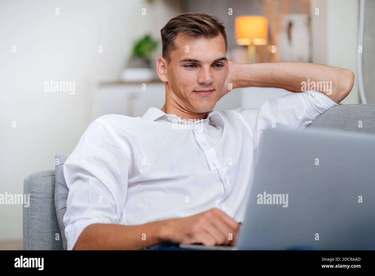 attractive young man using his laptop . people and technology. Stock Photo