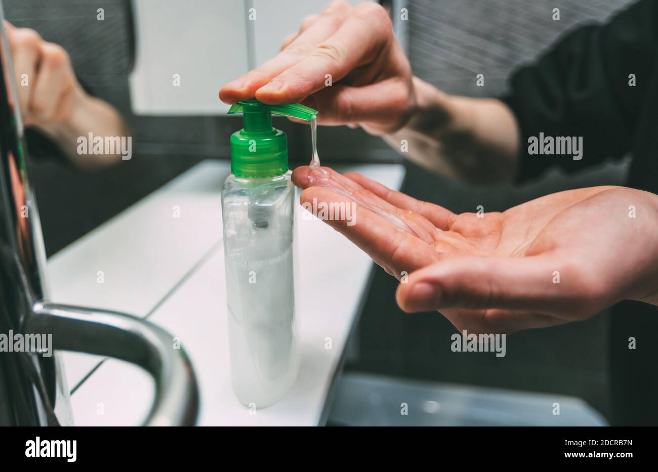 close up. young man washes his hands. Stock Photo