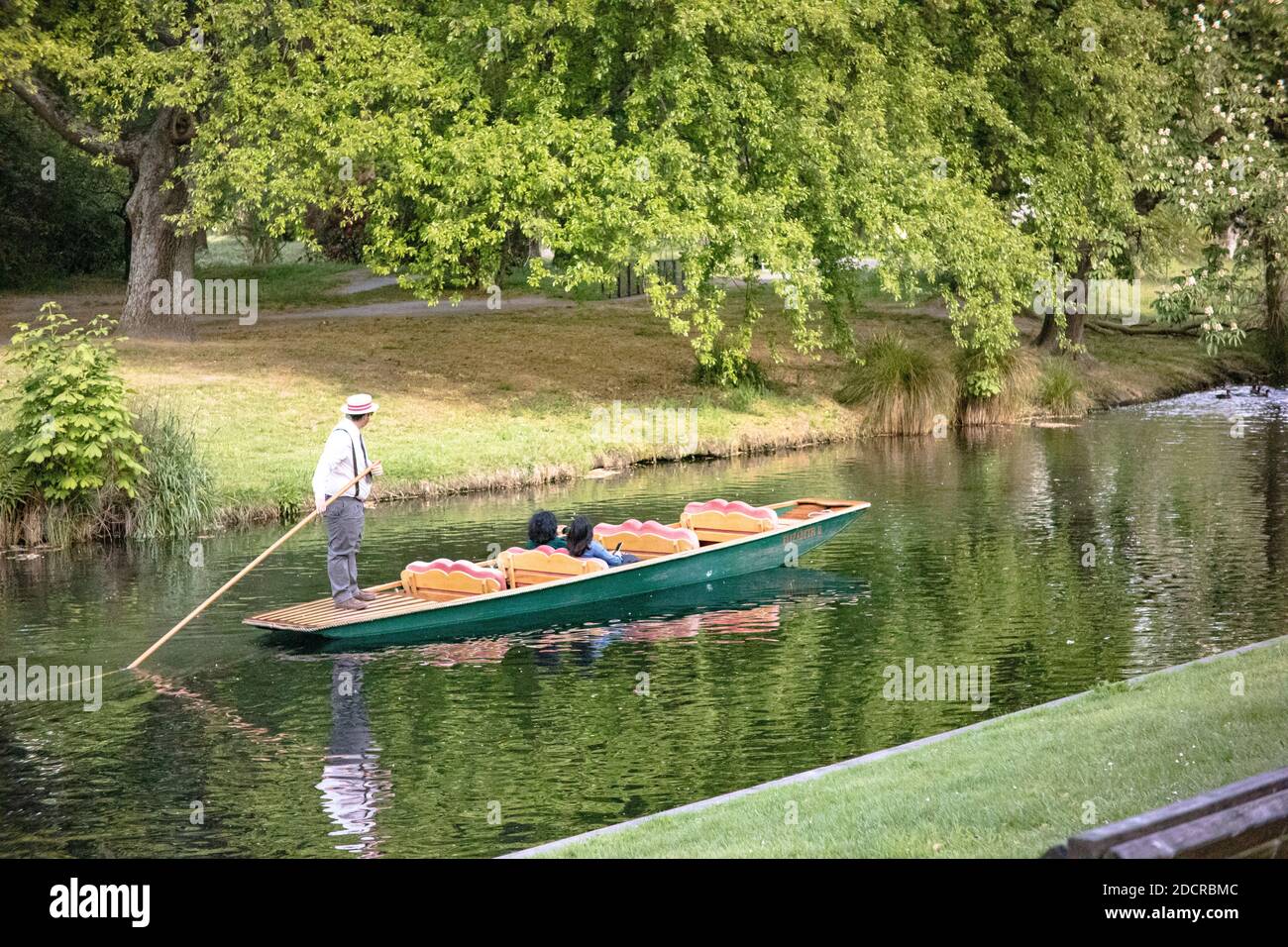A Punter making his way up the Avon River, Christchurch, with two passengers Stock Photo