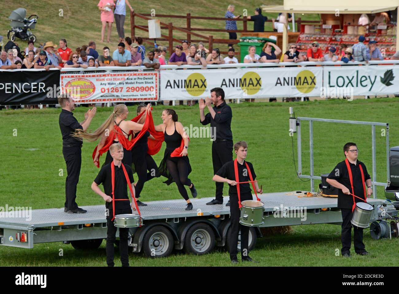 Performers and vintage machinery in a display and dance performance celebrating 100 years of the Royal Welsh Show 2019, Builth Wells Stock Photo