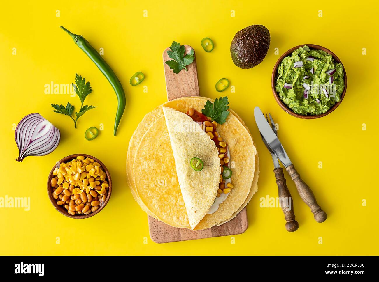 Tortilla wrap or burrito with corn, beans, greens, and homemade
