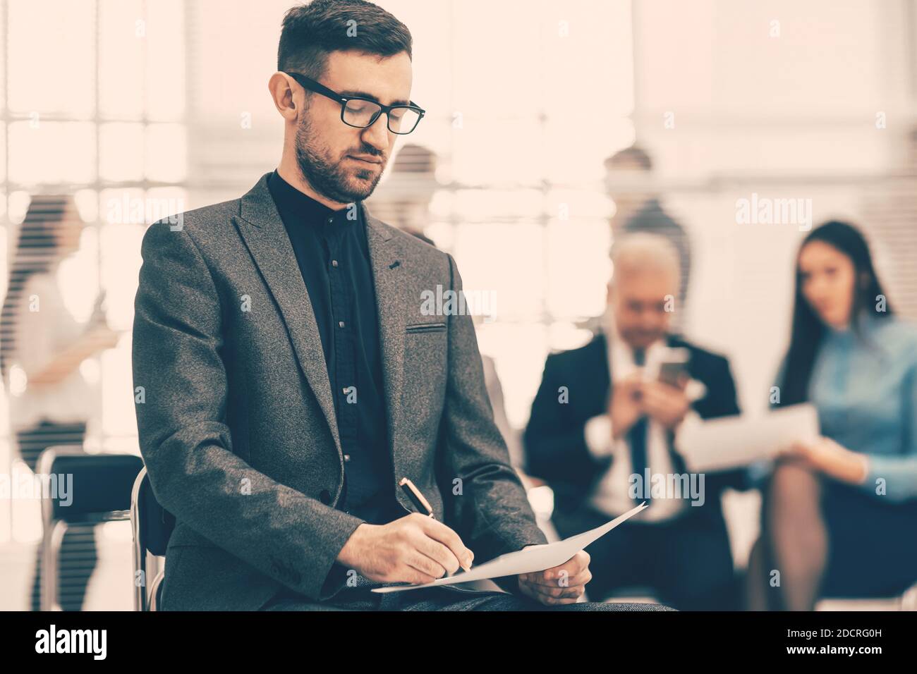 close up. financial consultant sitting in a modern office Stock Photo