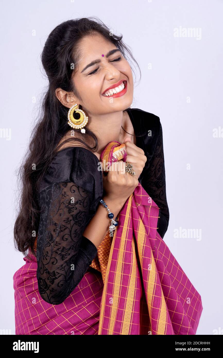 Indian woman in red sari smiling in front of camera. Happy Stock Photo ...