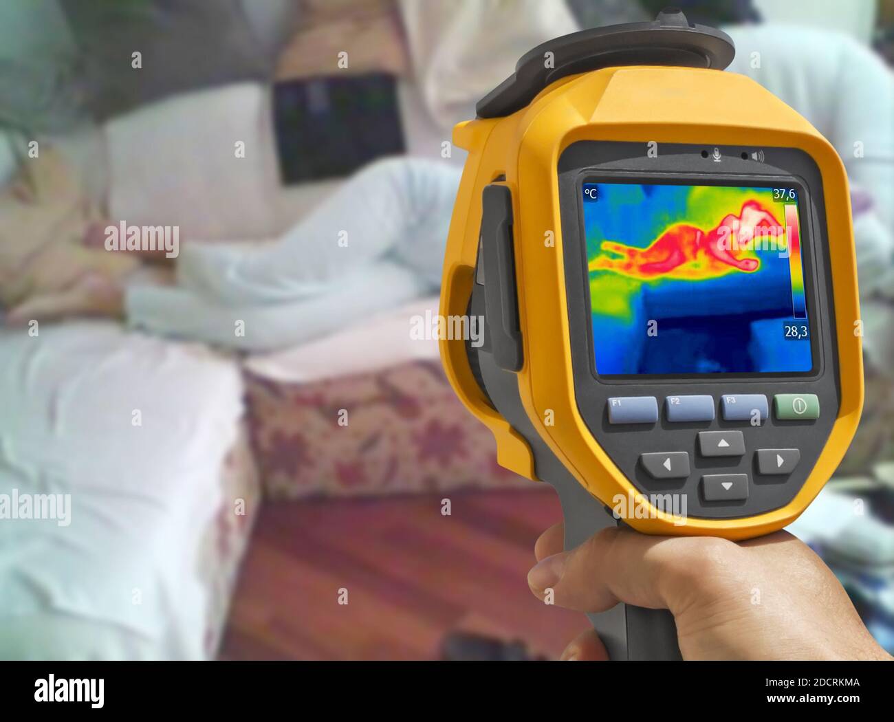 Recording with thermal camera Young woman is lying on the bed Stock Photo