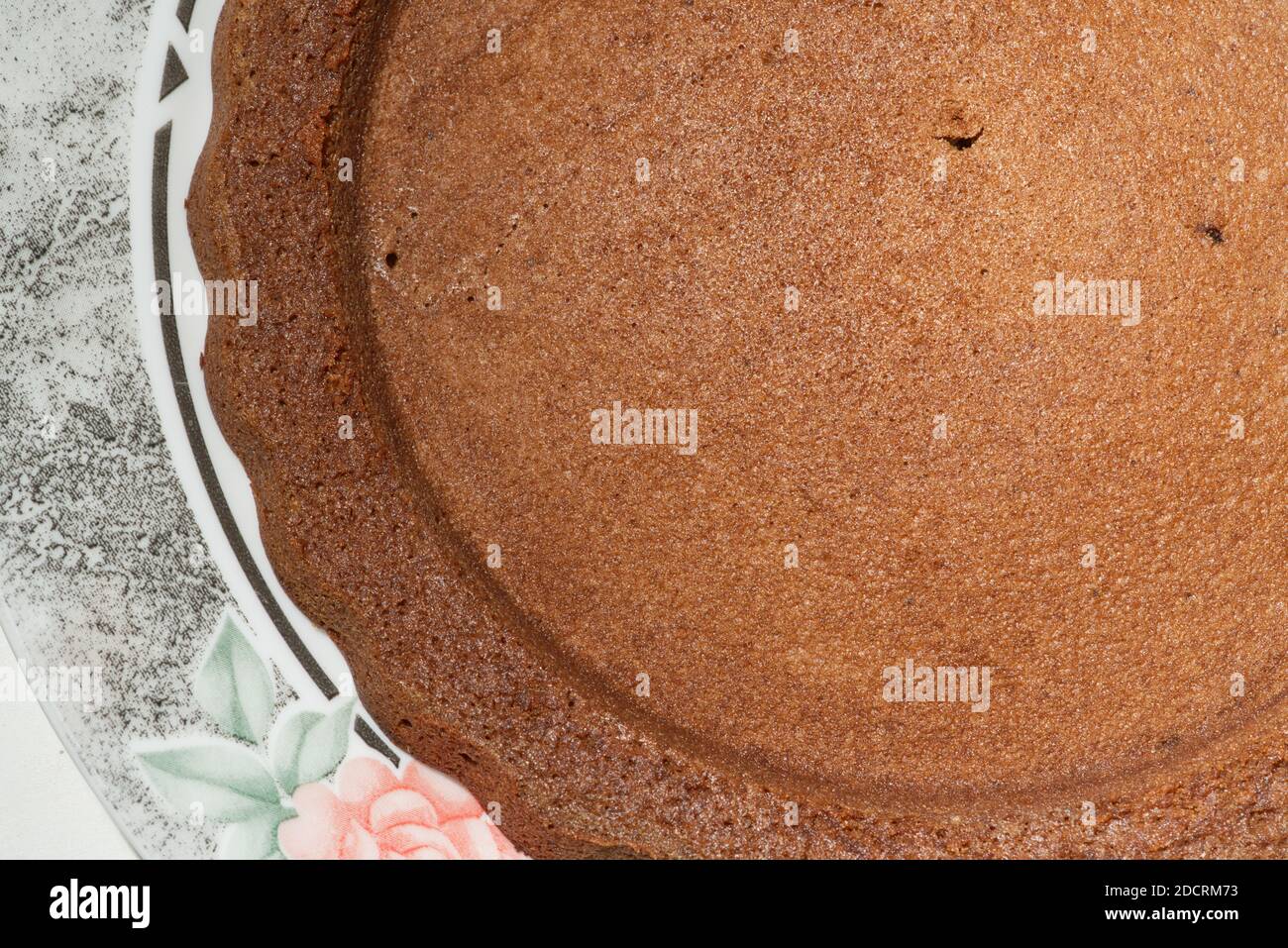 brown textured freshly baked sponge cake crust Stock Photo