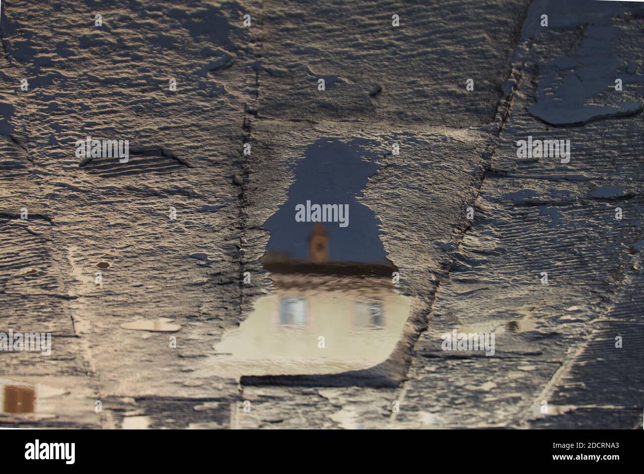 Reflections in the puddles of water after the storm Stock Photo - Alamy