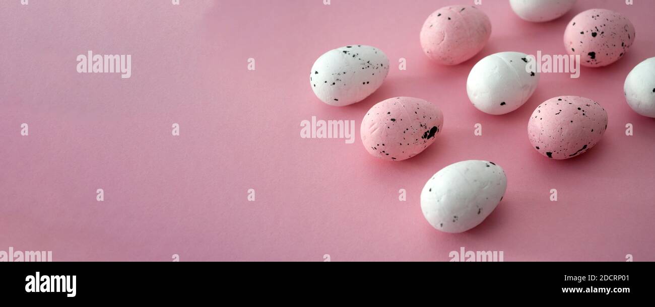 Pink easter banner, decorative eggs. Copy space for text. Stock Photo