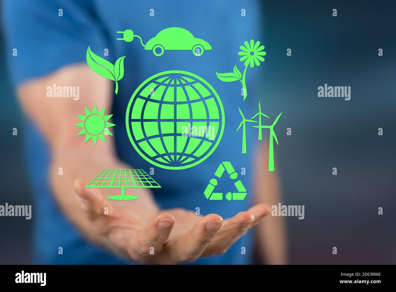 Clean energy concept above the hand of a man in background Stock Photo ...