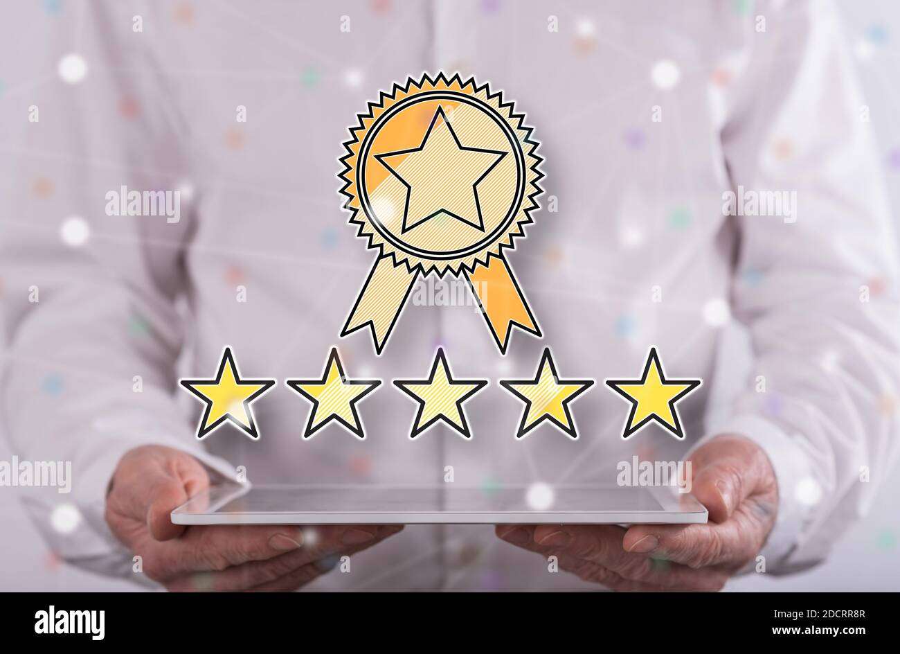 Quality concept above a tablet held by a man in background Stock Photo