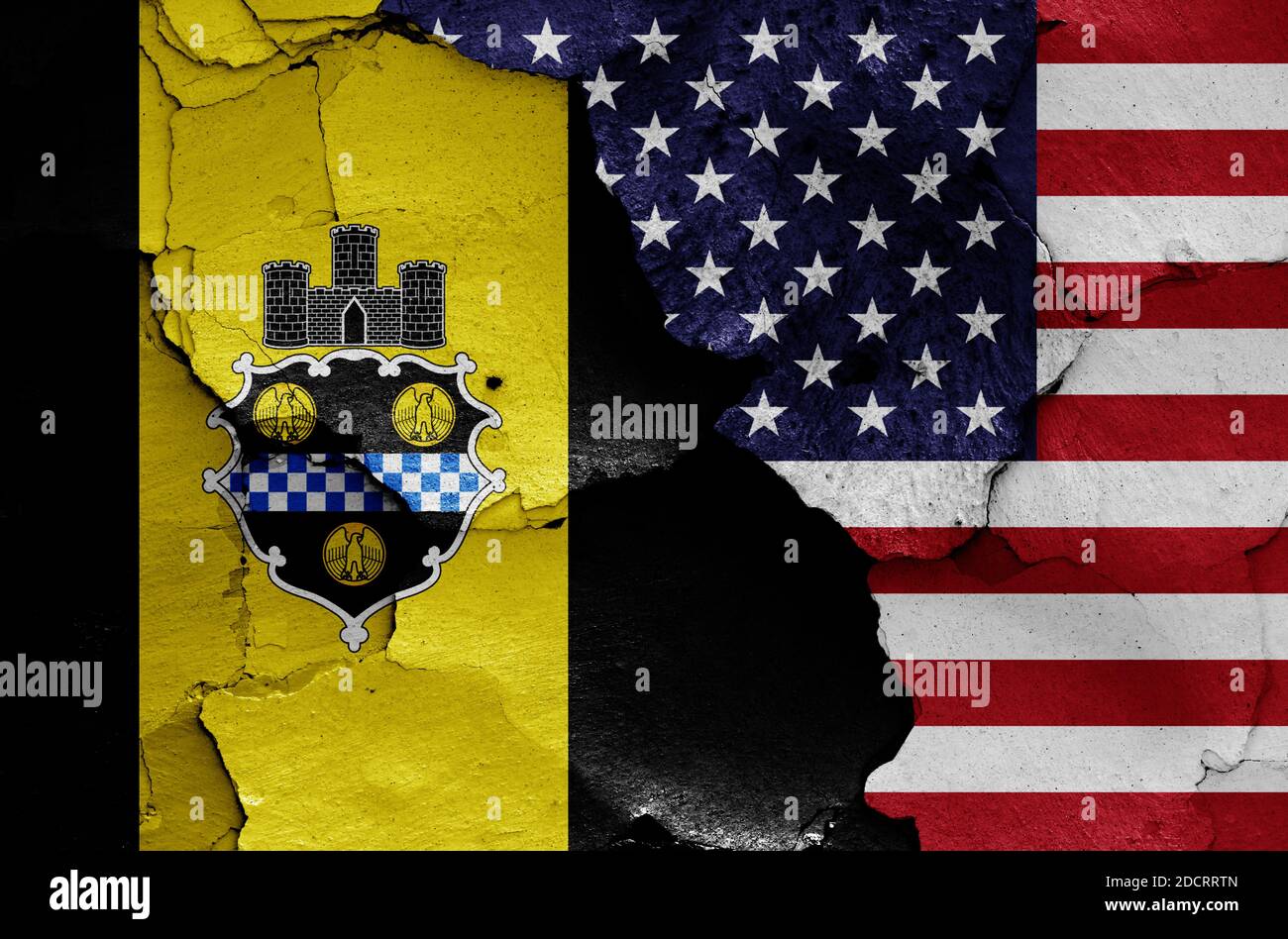 flags of Pittsburgh and USA painted on cracked wall Stock Photo