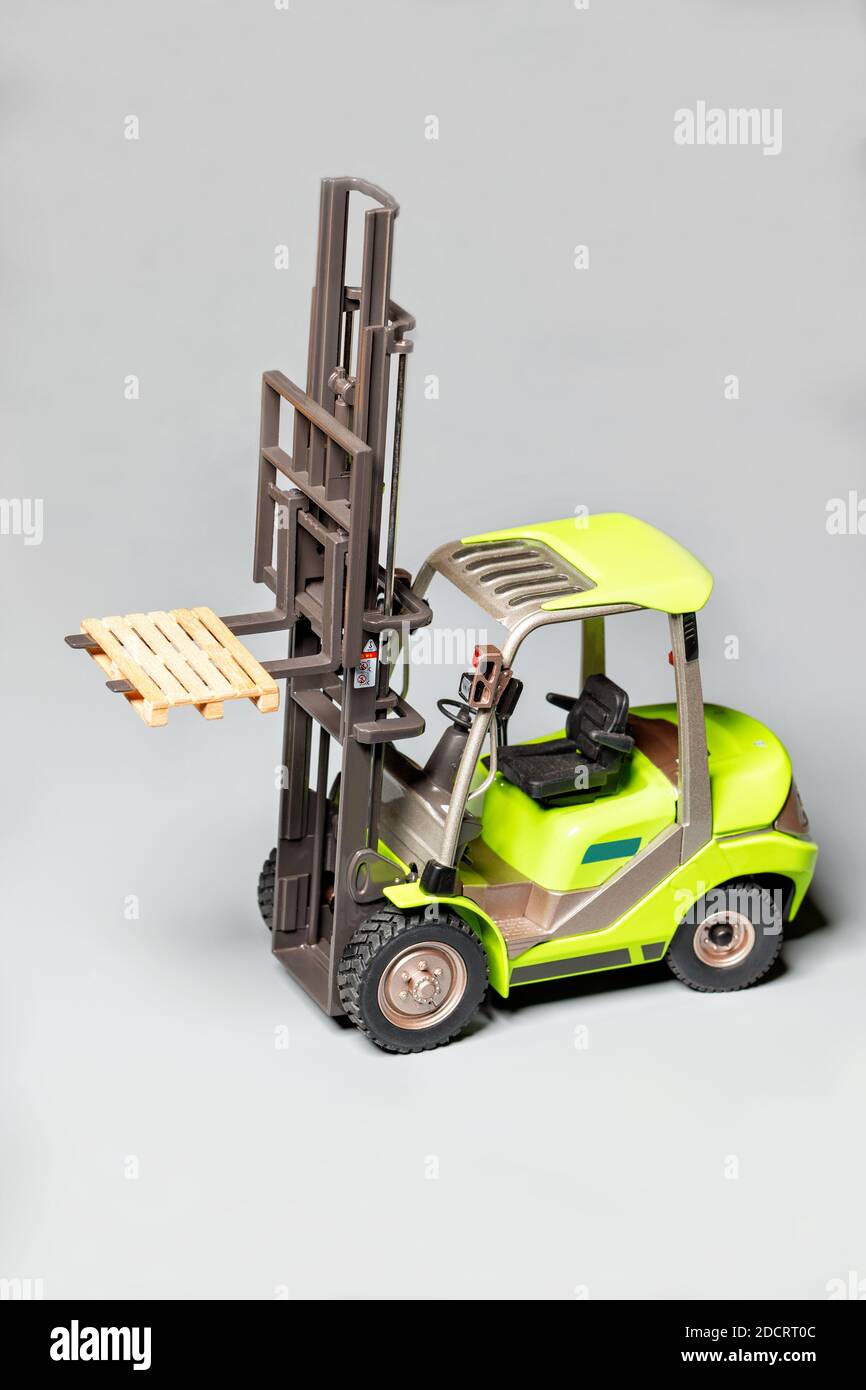 Toy model of an industrial telescopic handler, pallet loader, forklift