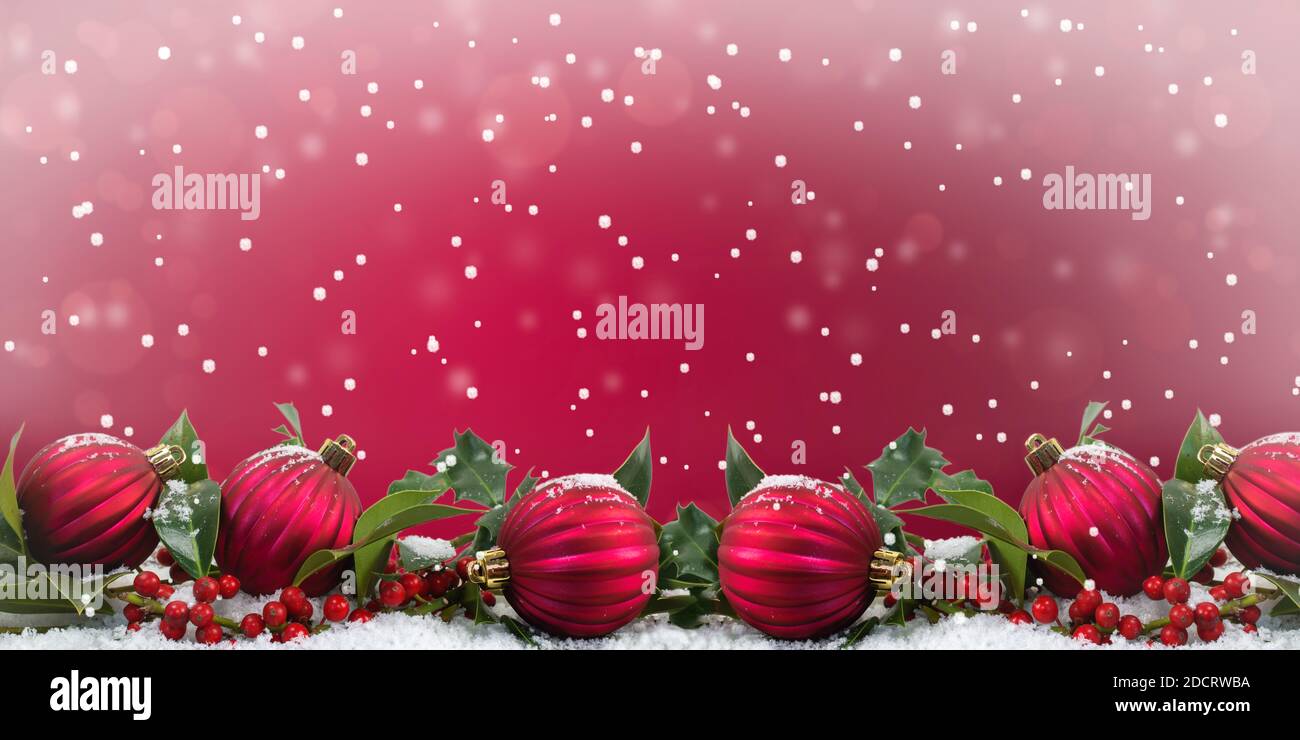 Red Christmas baubles festive winter decoration background. Stock Photo