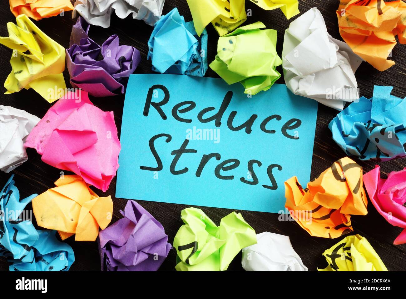 Reduce stress memo and colorful paper balls. Stock Photo