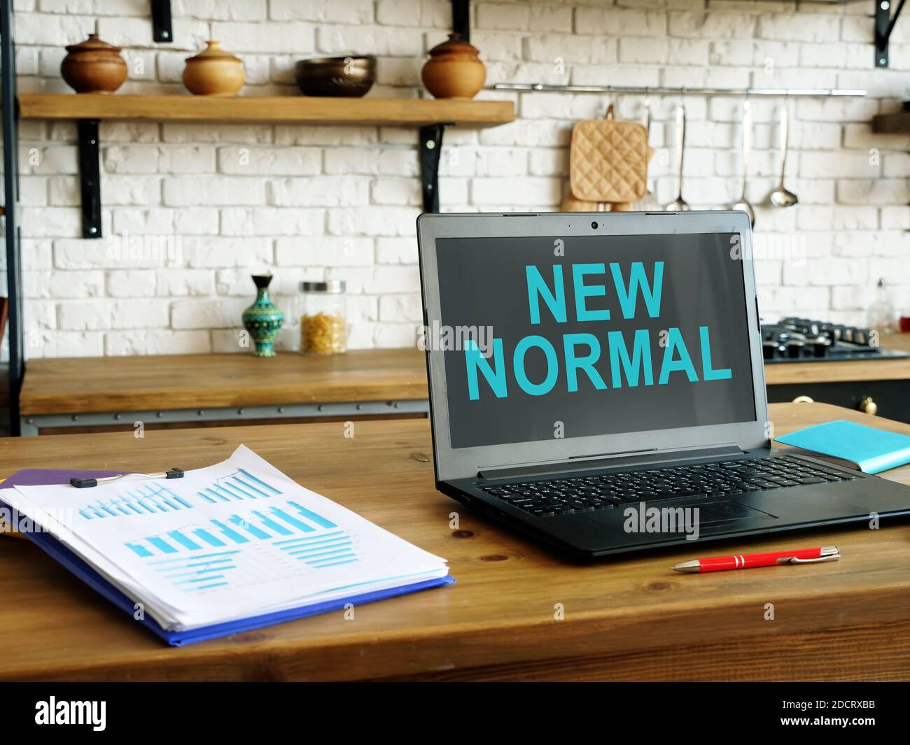 New normal words on the laptop screen for work at home. Stock Photo