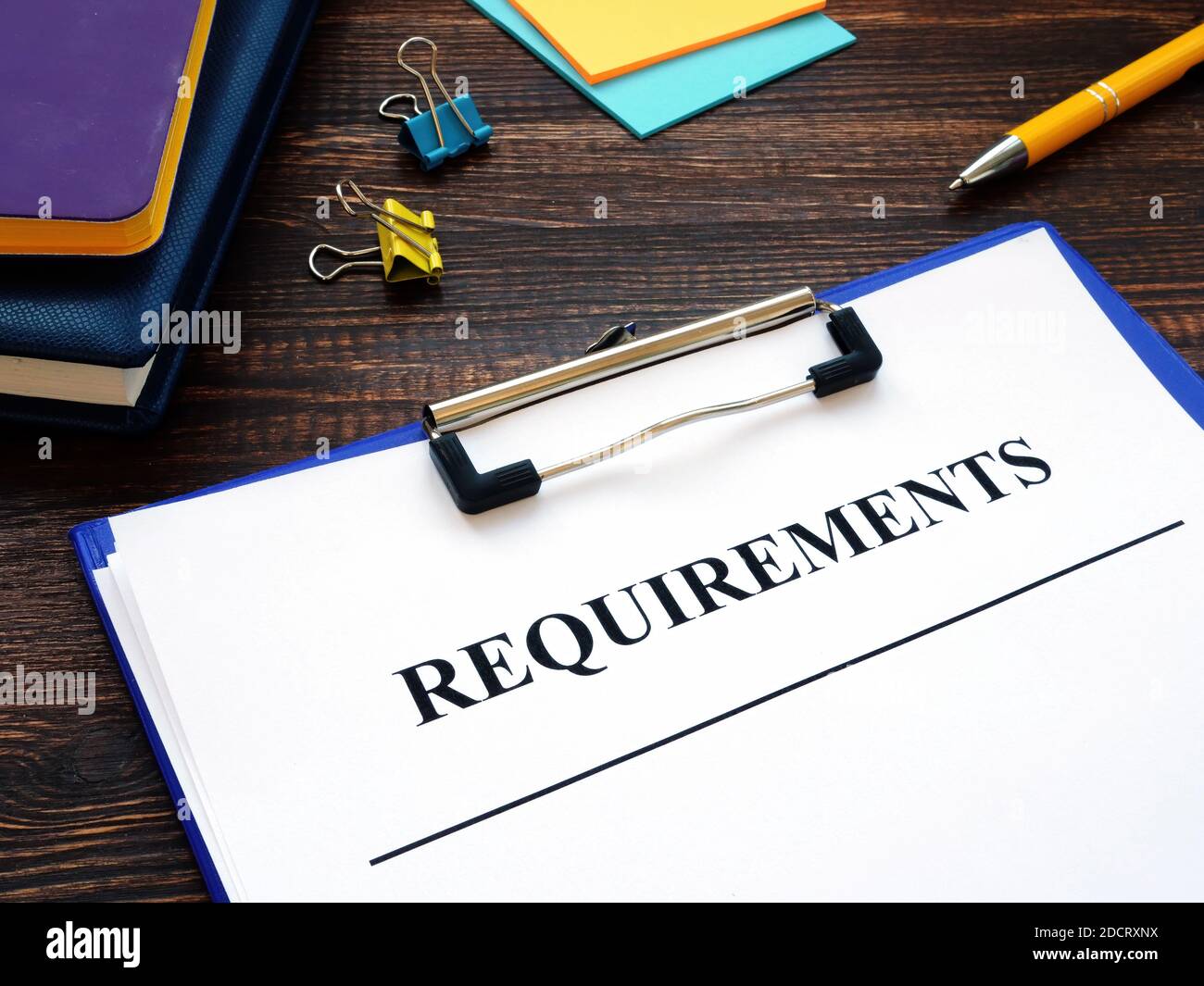 Business Requirements for work. Papers with clipboard on the desk. Stock Photo