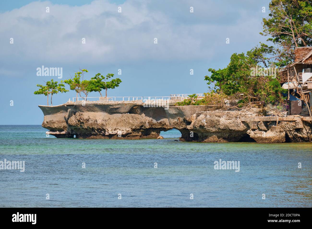 famous landmark of Boracay island. A small rock in the sea. Tourists ...