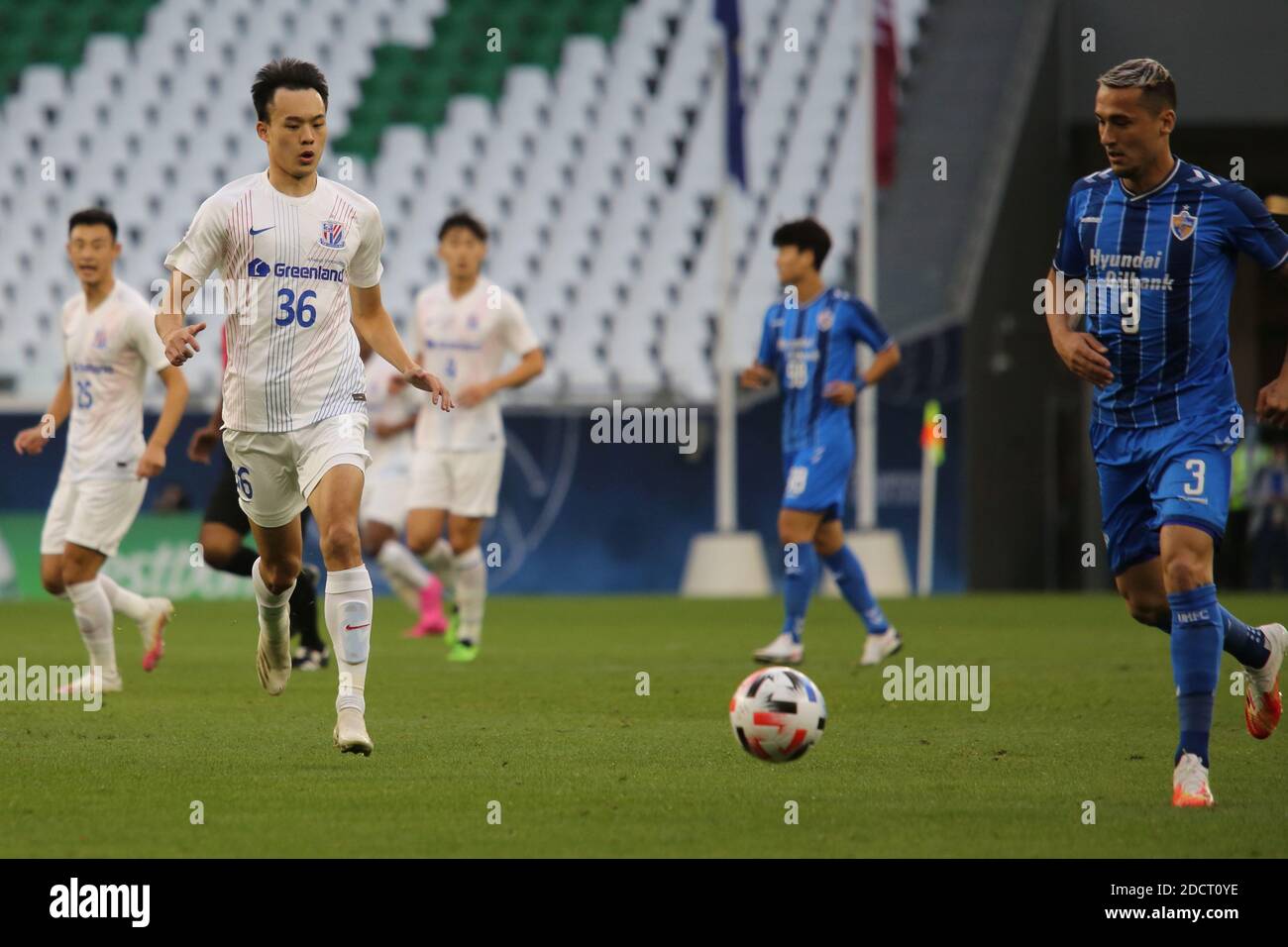 DOHA, QATAR - NOVEMBER 21: Wang Wei of Shanghai Shenhua and Jason ...