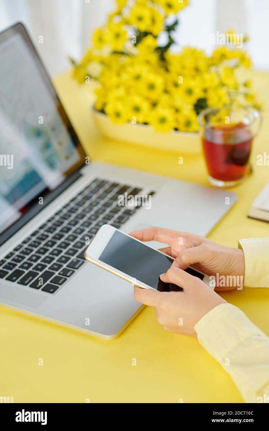 Businesswoman using mobile application Stock Photo