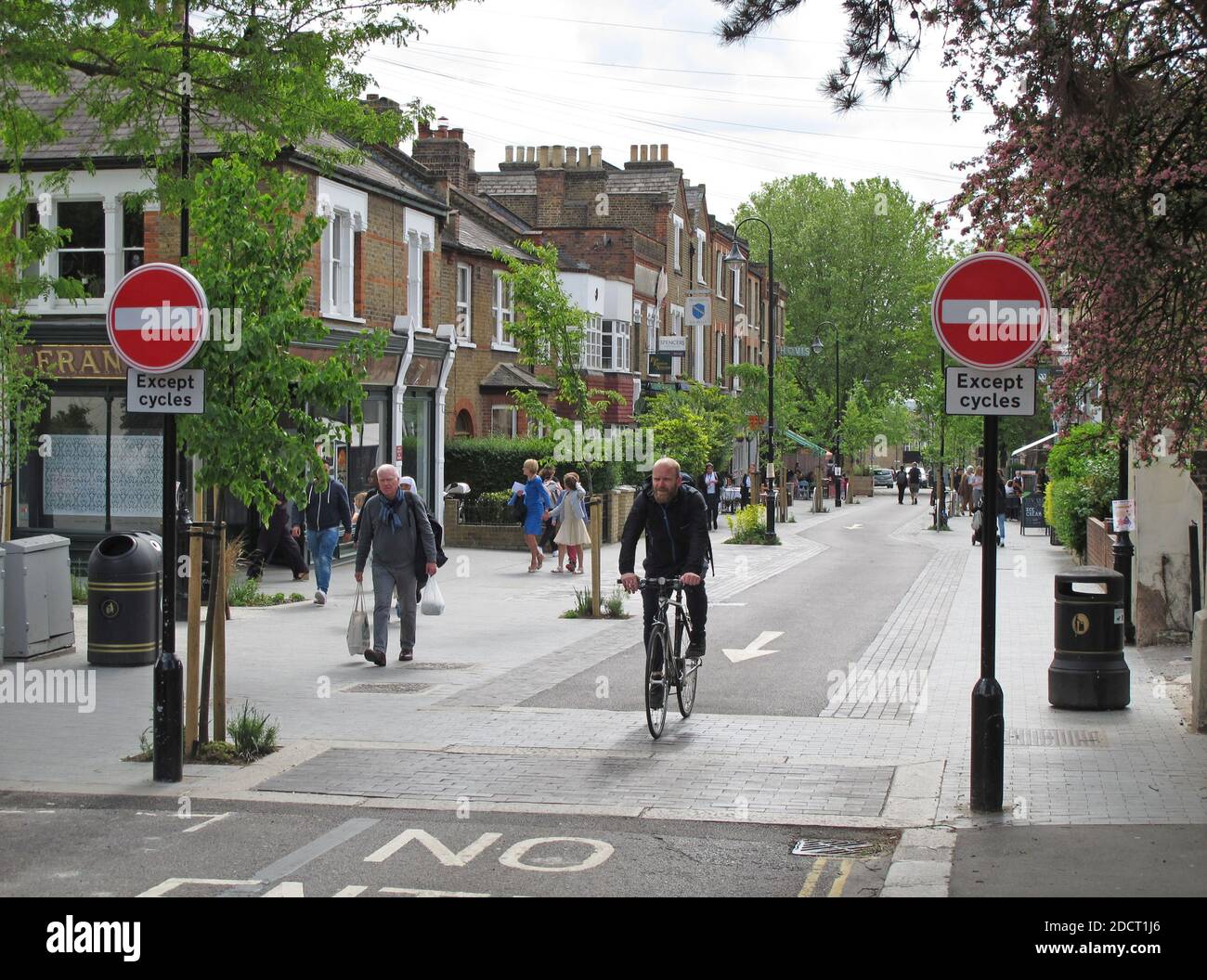 A cyclist rides through Orford Road, Walthamstow,London, UK. Newly