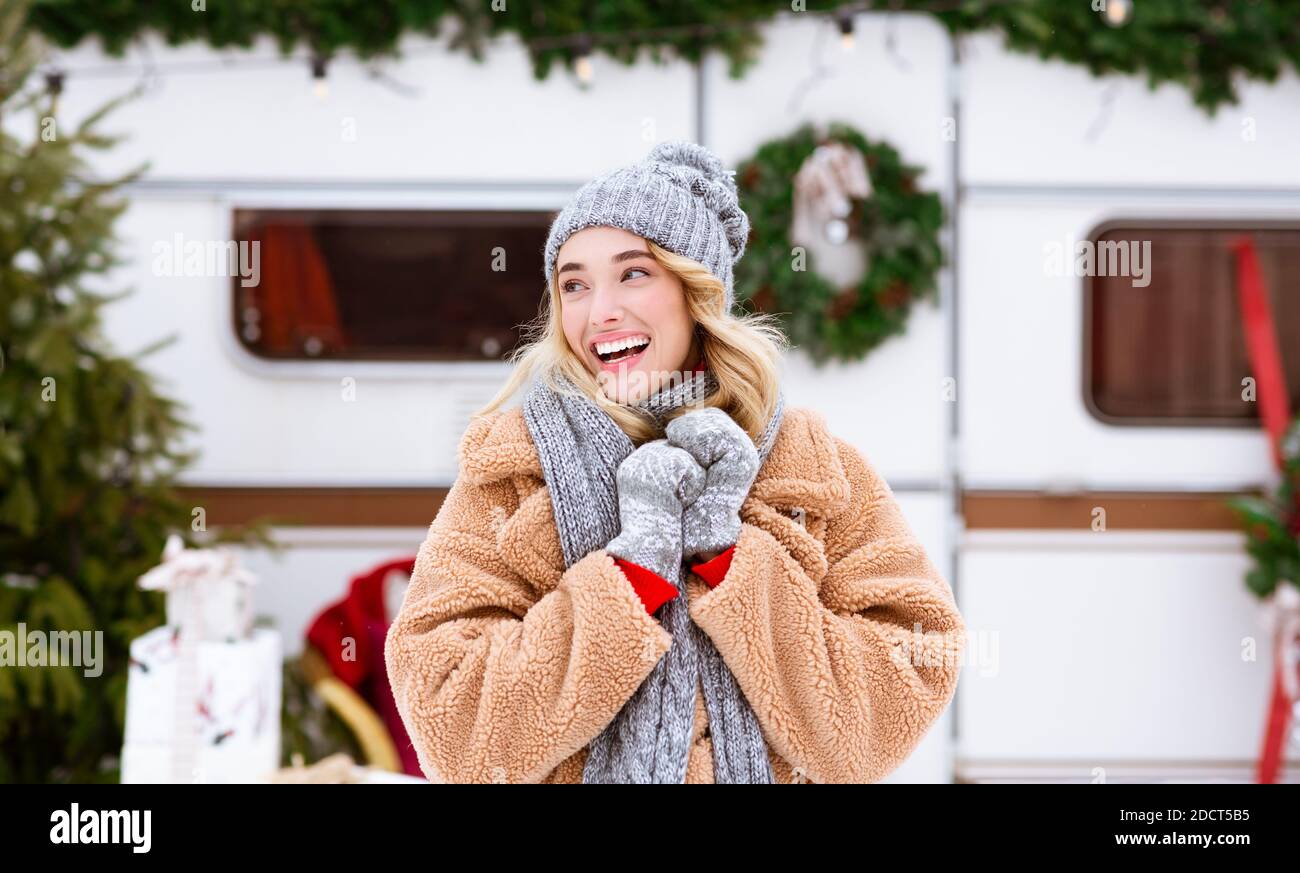 Excited Young Blonde Woman Enjoying Spending Time Outdoors At Winter Camping Stock Photo