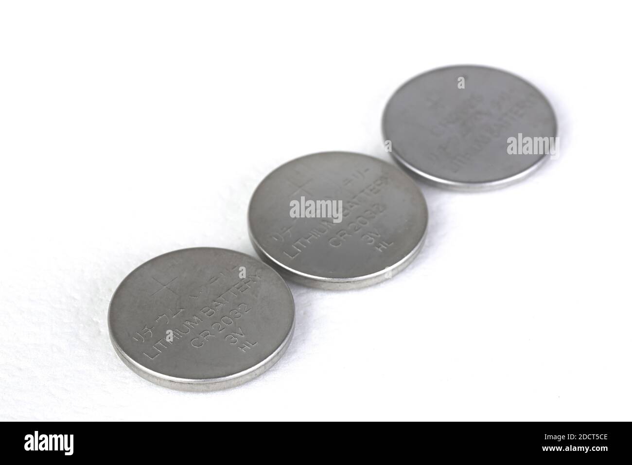 closeup on Lithium batteries of various sizes arranged on white background Stock Photo