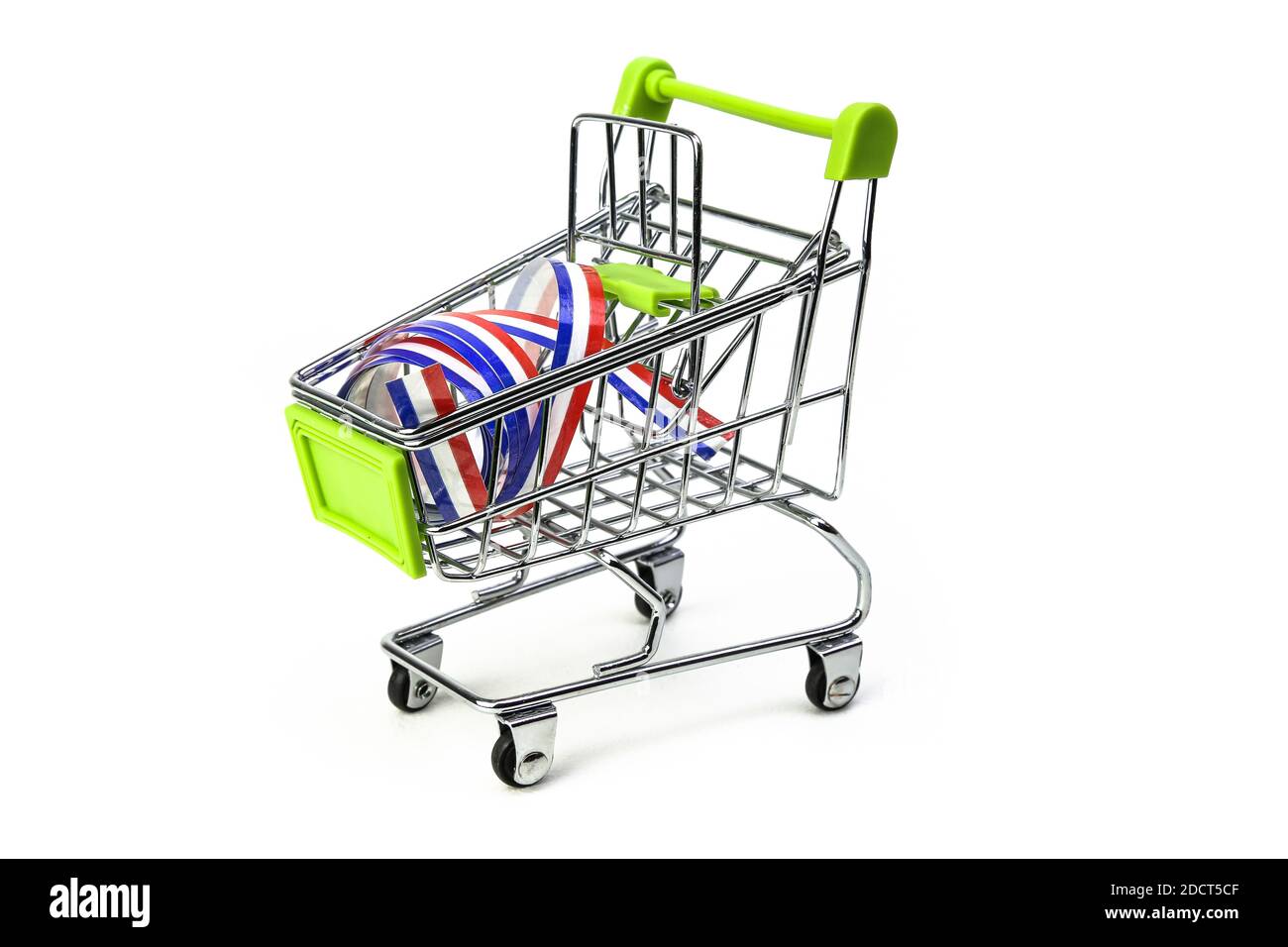 closeup on supermarket shopping cart isolated with a French tricolor ribbon,  symbol of purchase of products made in France Stock Photo - Alamy