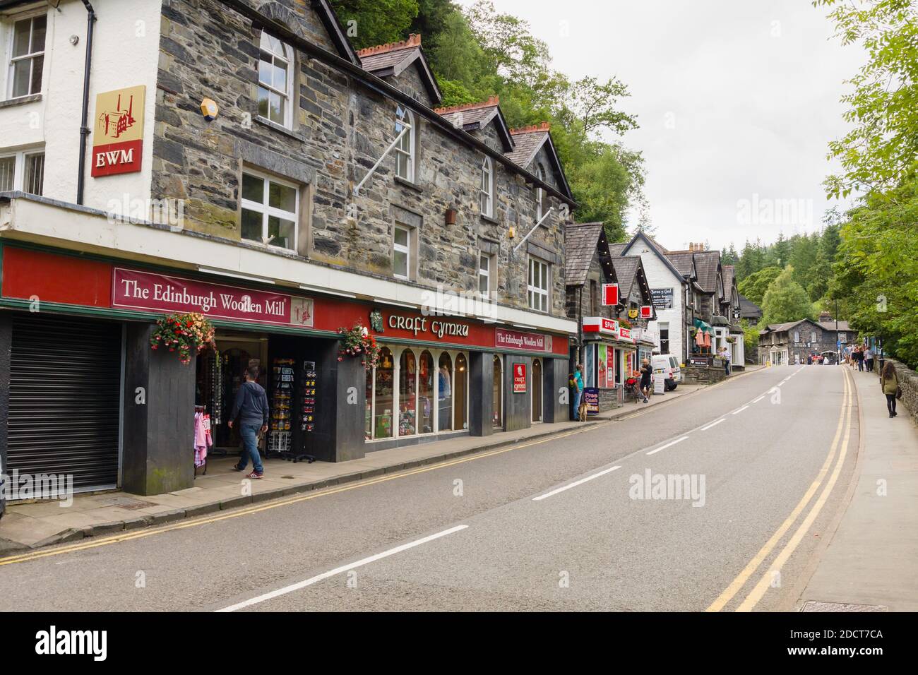 The Edinburgh Woollen Mill Craft Cymru store on the high street of Betws-y-Coed in the Snowdonia National Park North Wales Stock Photo