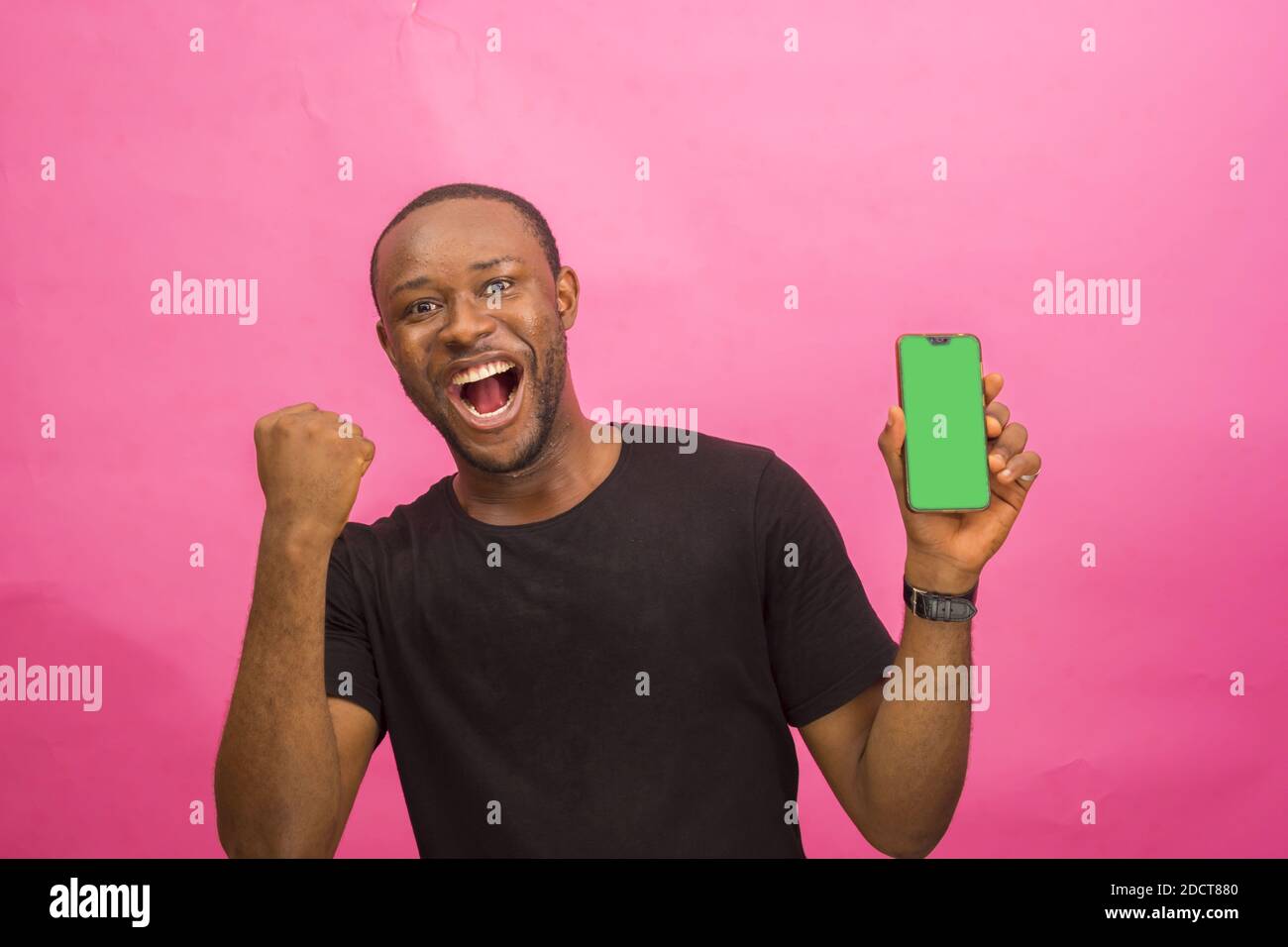 Excited man showing phone hi-res stock photography and images - Alamy