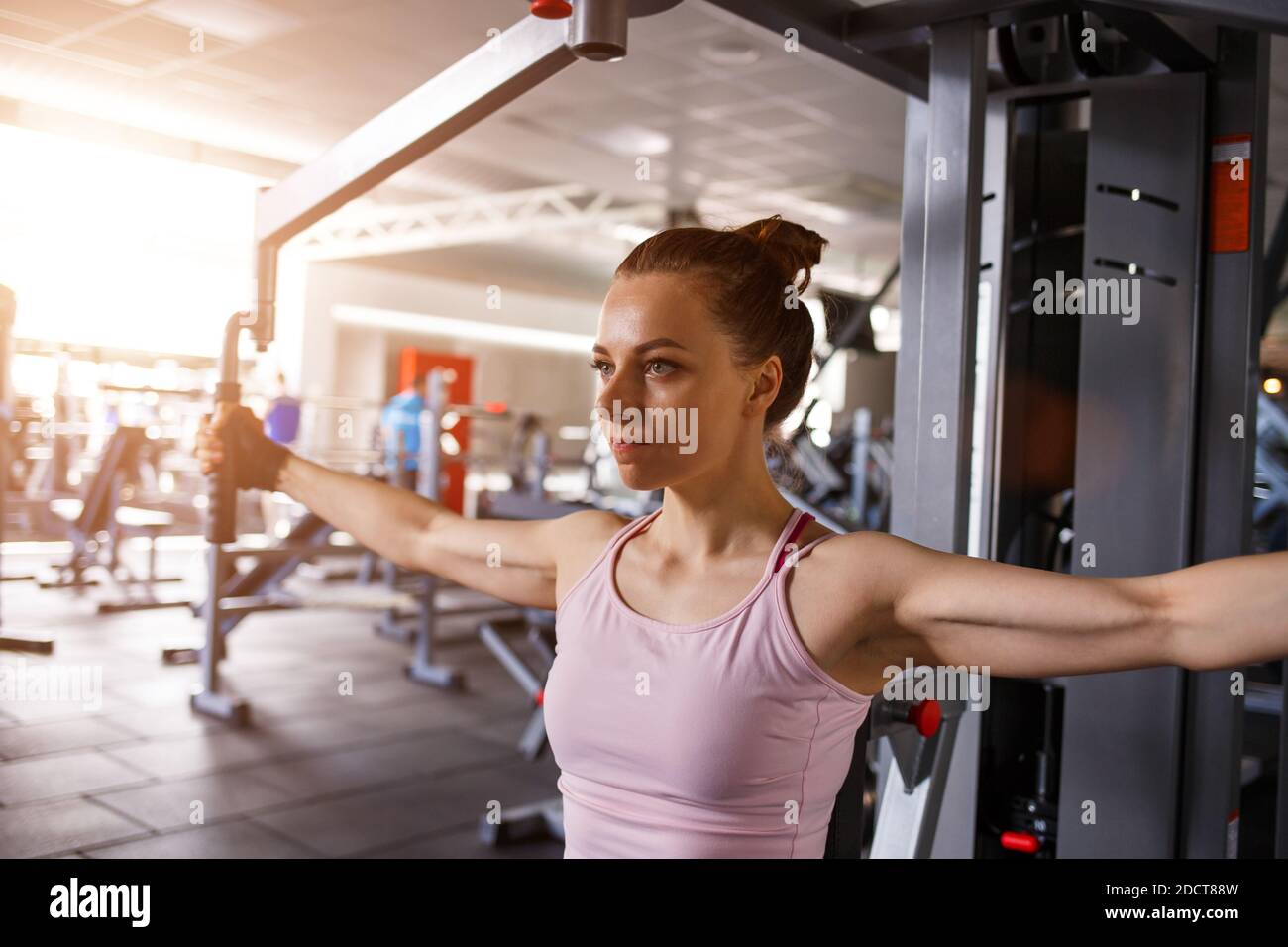 Young fitness woman working out in gym Stock Photo