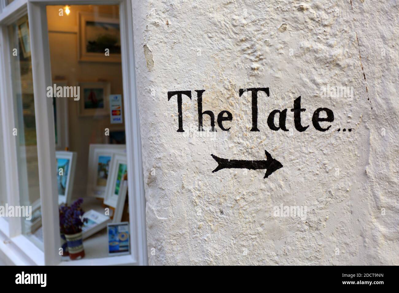 England / Cornwall / St. Ives / Sign on gallery showing the way of Tate St Ives . Stock Photo