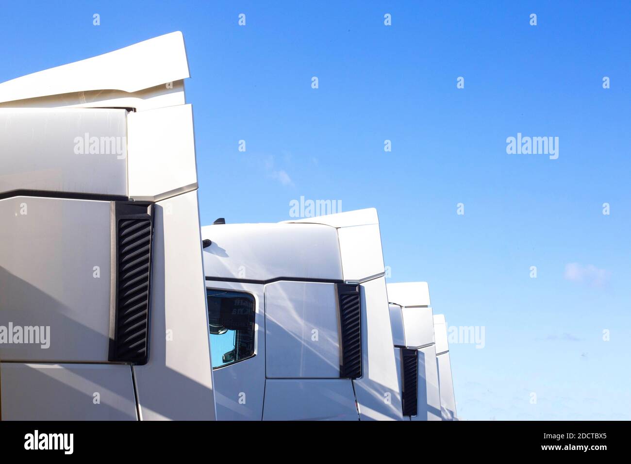 Spoilers and fairings for cabins on truck tractors against the blue sky. Aerodynamic effect concept, copy space for text, transporter Stock Photo