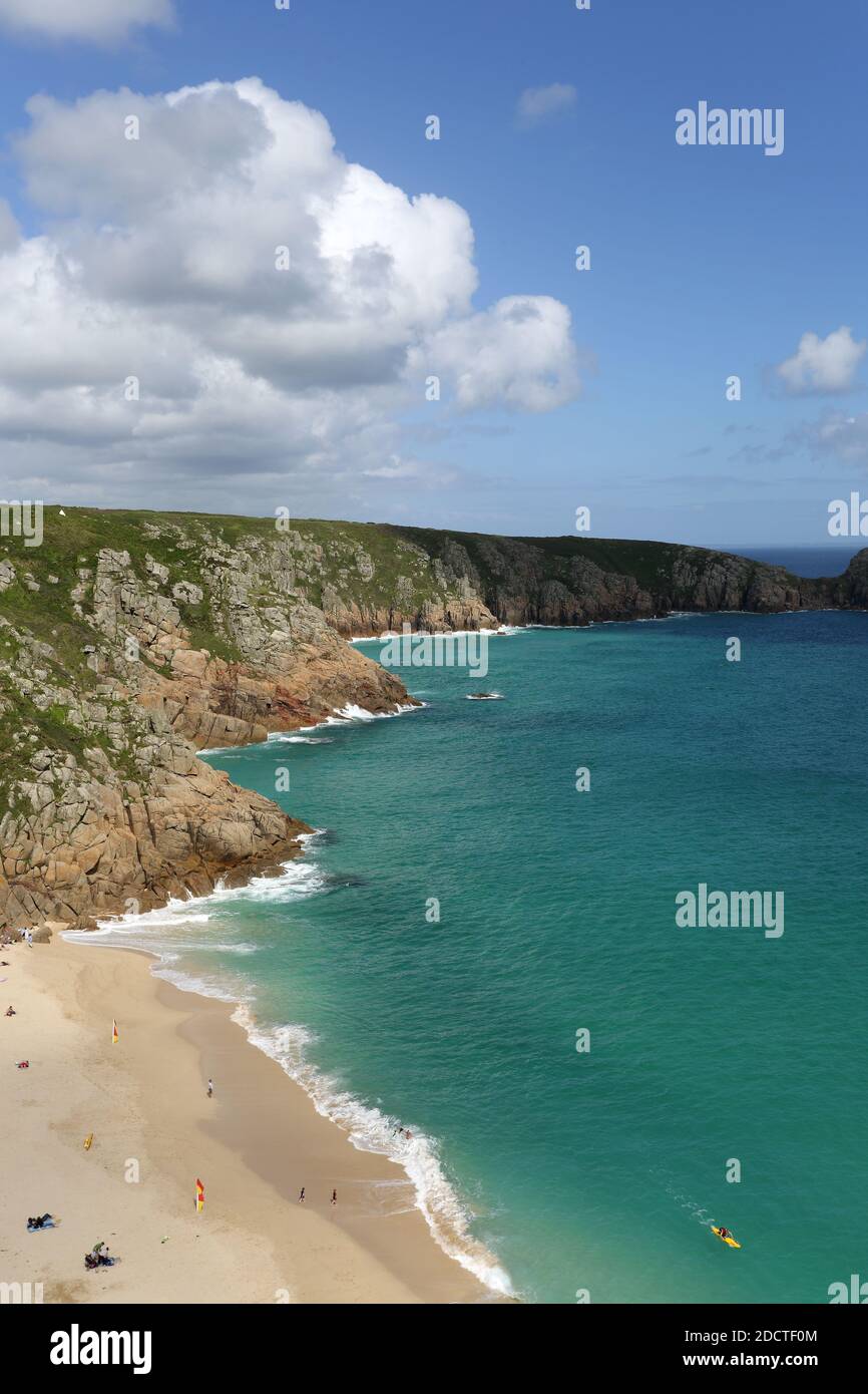 Above Porthcurno beach panorama with people on a sunny summer day in Cornwall UK Stock Photo
