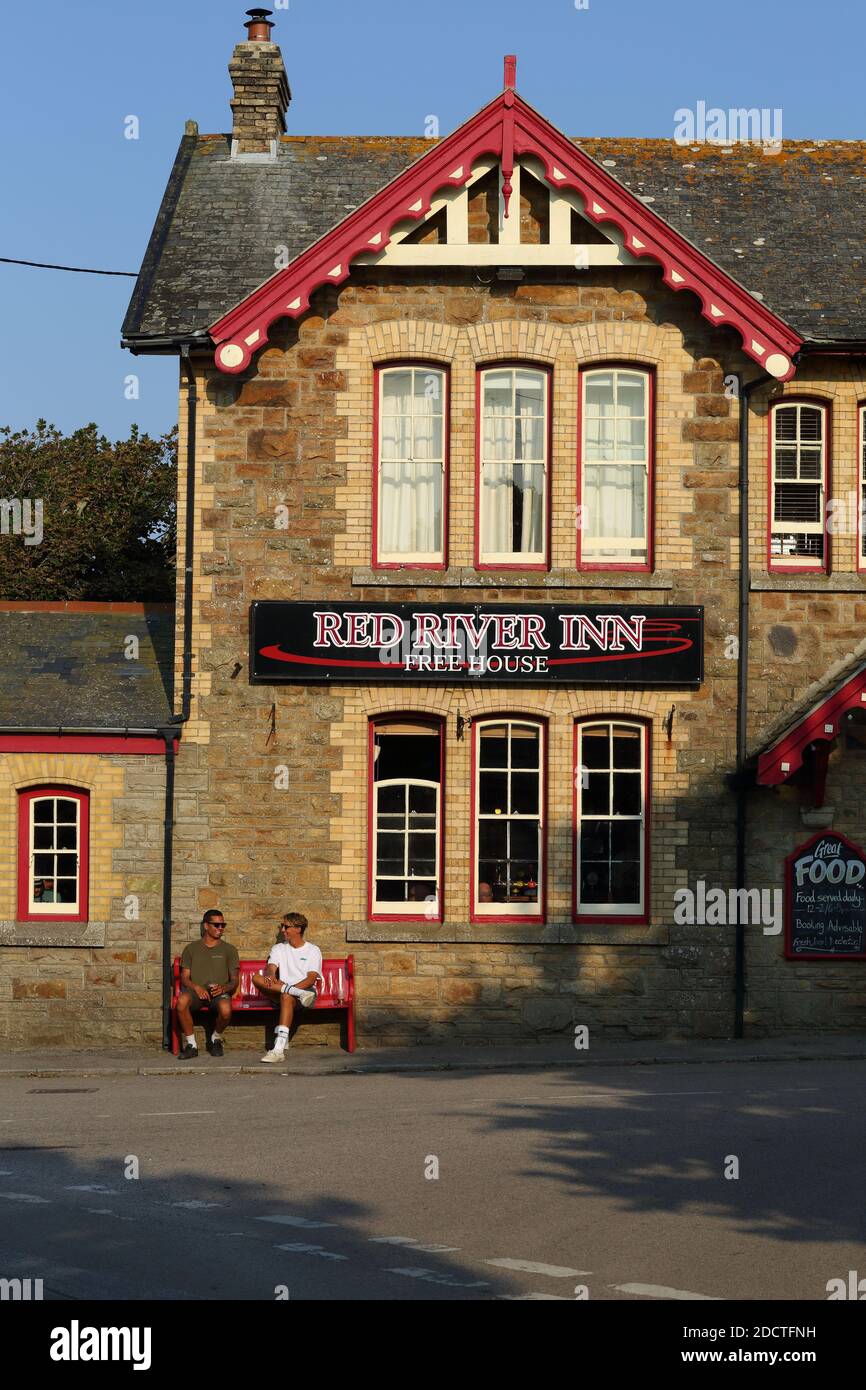 GREAT BRITAIN /Cornwall/Two young man siting outside pub  near Portreath Heritage Coast.Red River Inn Pub and Restaurant in Gwithian, Cornwall. Stock Photo