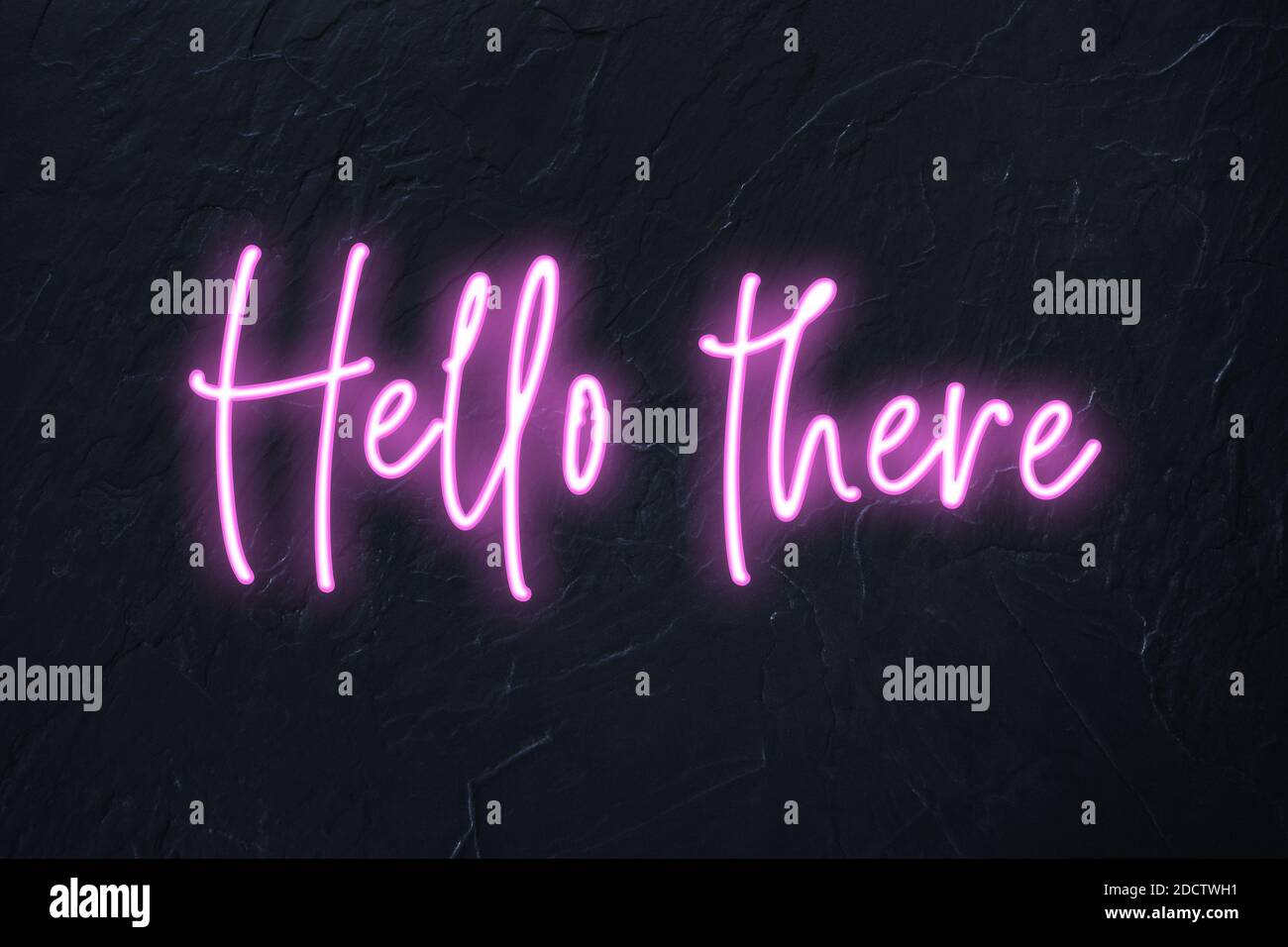 Hello there written in pink neon style on black wall background Stock Photo