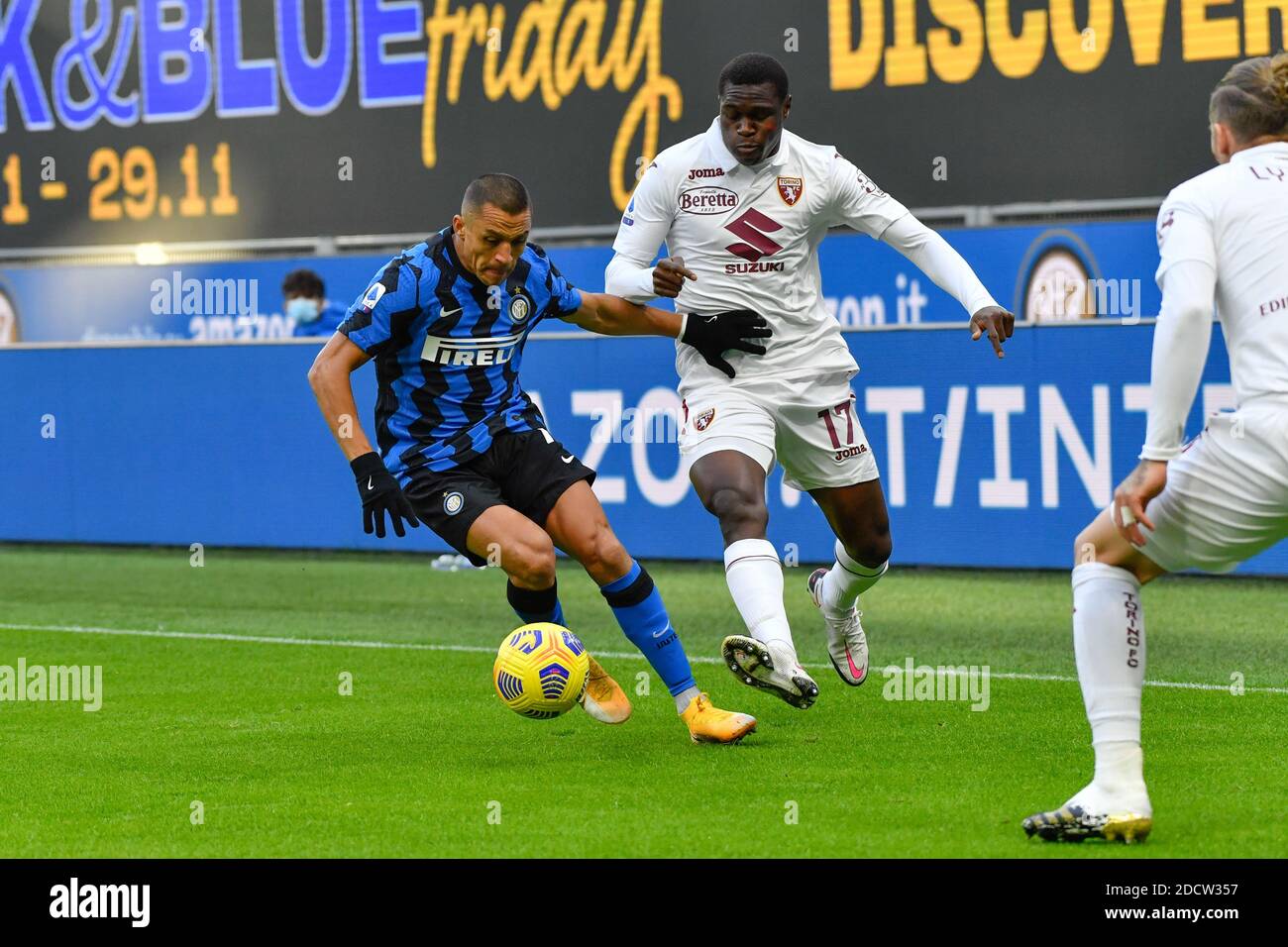 Milano, Italy. 22nd Nov, 2020. Alexis Sanchez (7) of Inter Milan and  Wilfried Singo (17) of Torino seen in the Serie A match between Inter Milan  and Torino at San Siro in