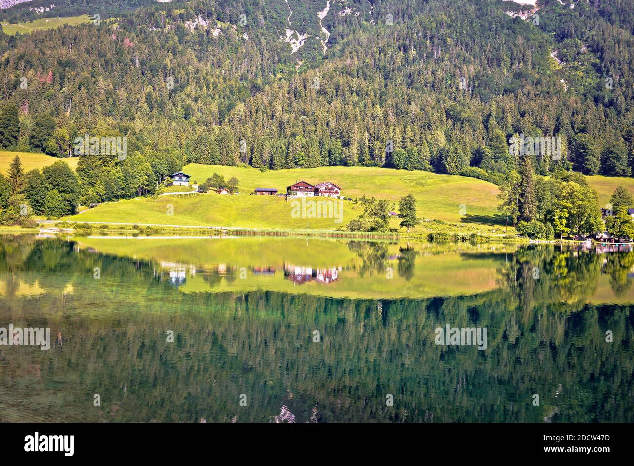 Bavarian Alps lake reflection, Hintersee lake in Berchtesgaden Alpine landscape mirror view, Bavaria region of Germany Stock Photo